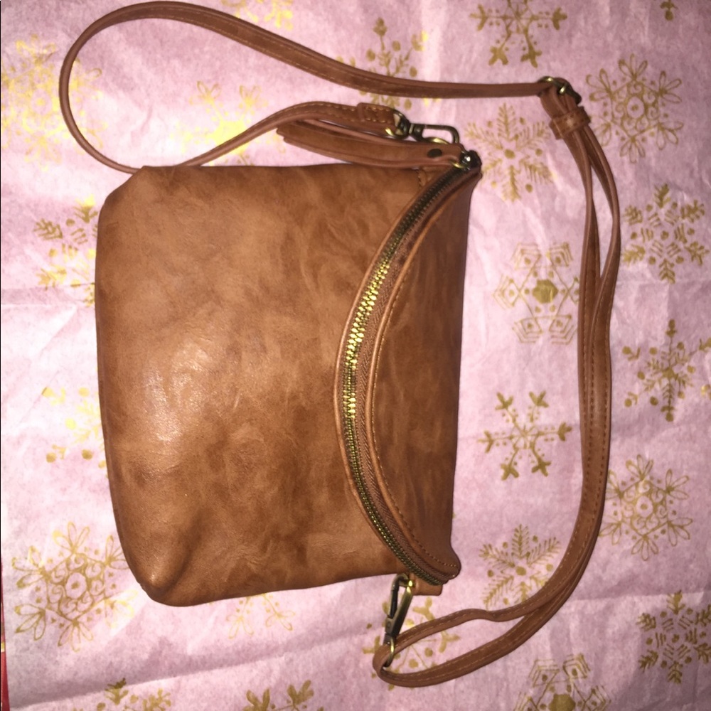 NWOT Crossbody Bag with multiple compartments.
